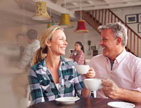 man and woman having coffee together