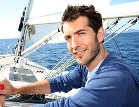 rich handsome man on boat