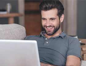 handsome man using a laptop