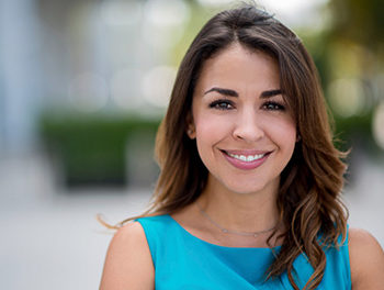 woman smiling with blue top