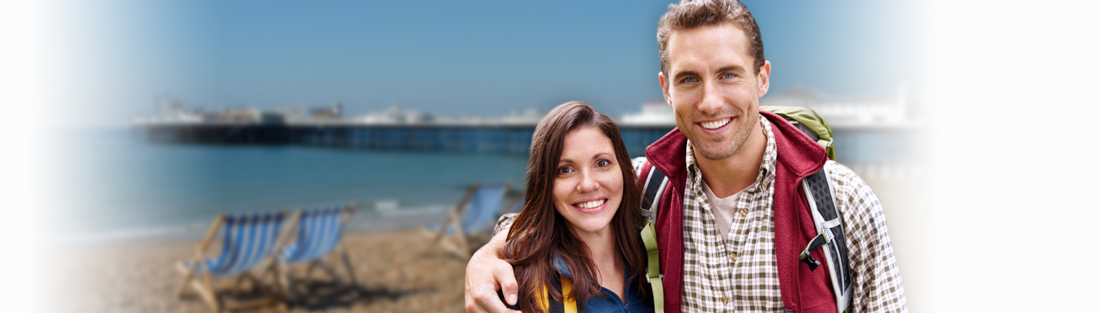 brighton couple in front of pier