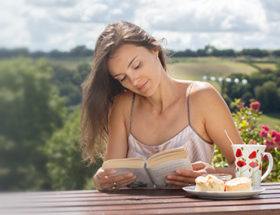 girl reading outside
