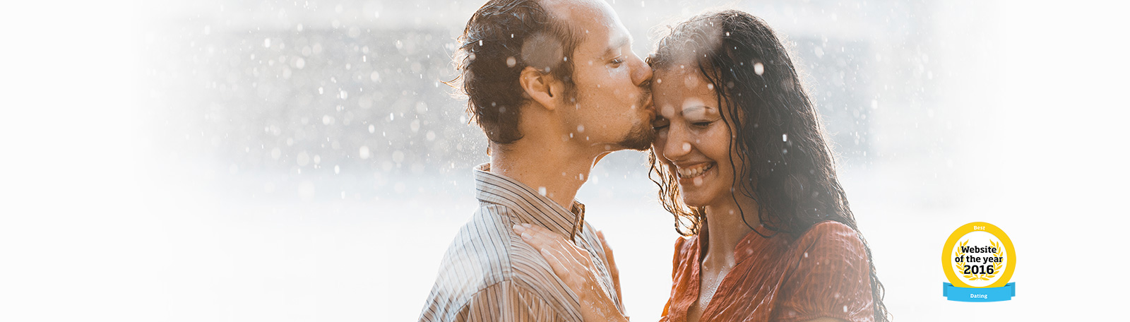 man and woman kissing in the rain