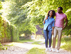 couple walking through countryside