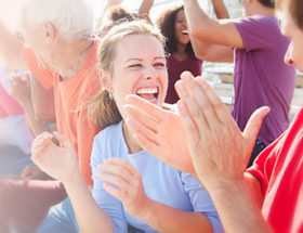 woman clapping in a sports games crowd