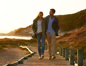 couple walking on pier