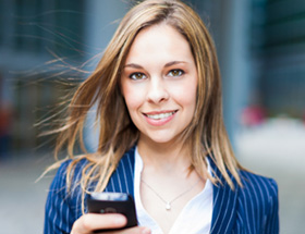 woman holding her phone