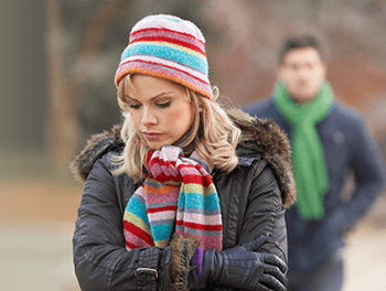 woman walking away from boyfriend