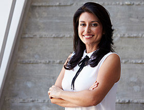 woman in blouse smiling