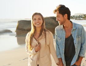 Couple walking on a romantic beach