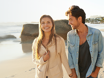 Couple walking on a romantic beach