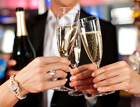 hands holding champagne glasses
