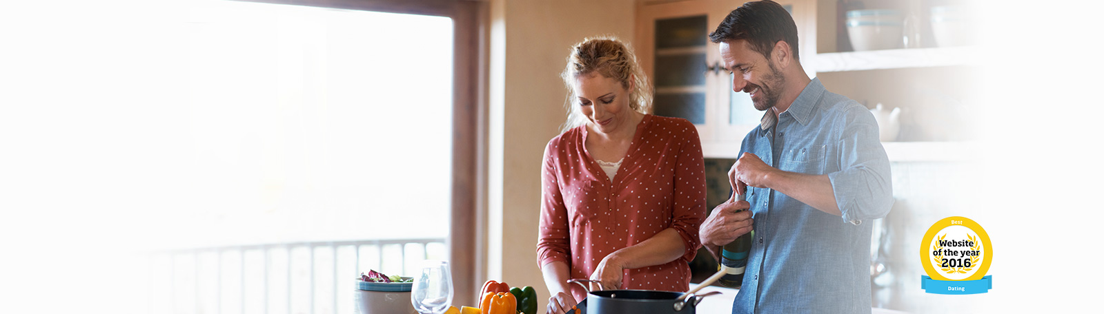 man and woman in a kitchen cooking together