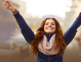 happy single woman with arms in the air