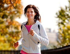 Woman jogging in the autumn