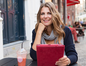 woman outside on the tablet