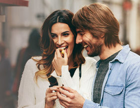 Happy couple laughing on a date